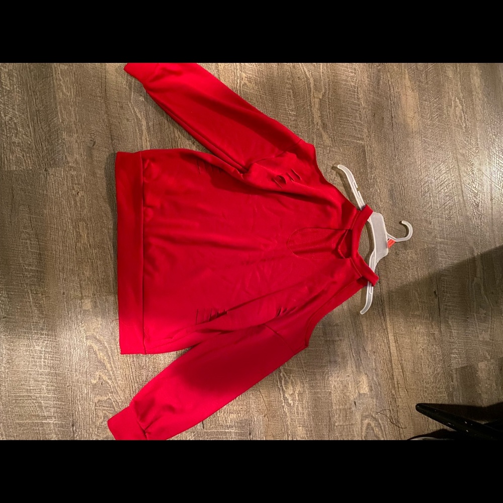 Women’s sweatshirt. Ripped look. New without tags. Never worn.